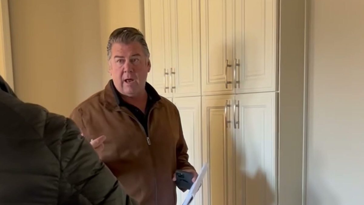 Walking through a customer’s kitchen with the plans in hand